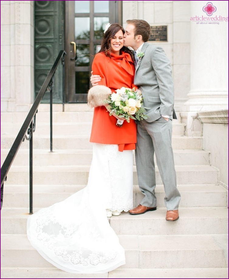 Red coat on the bride