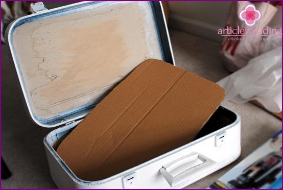 Cut a cardboard part for a suitcase