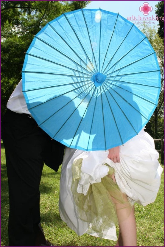 Silhouettes on the umbrella for wedding photography