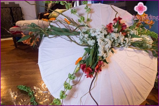 Ready umbrella with flowers and greenery