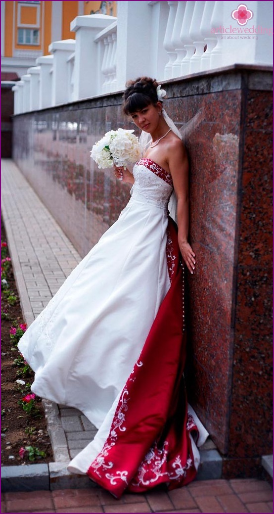 Wedding dress with a burgundy train