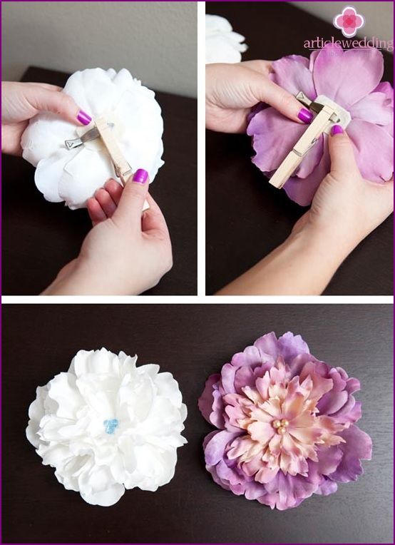 Glue the clip on the back of the flower and hold it to dry