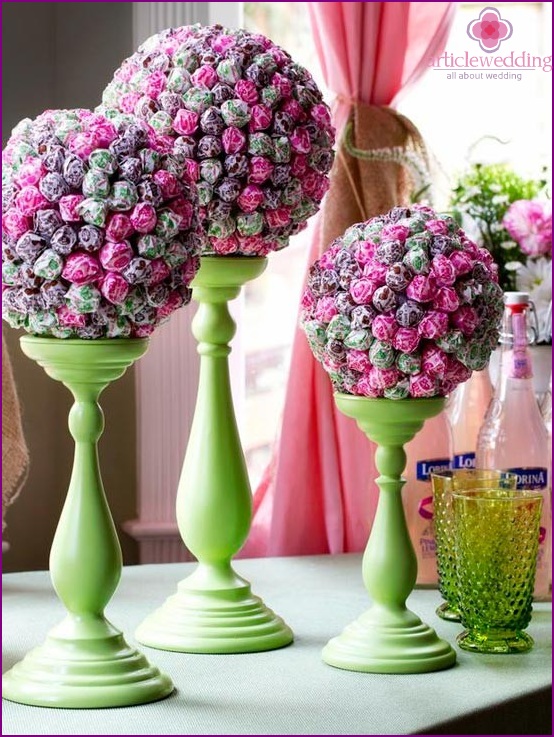 Sweet topiary on candle stands