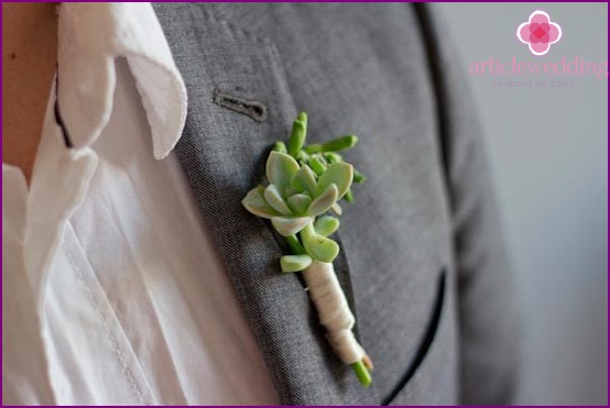 Attach the boutonniere to the jacket