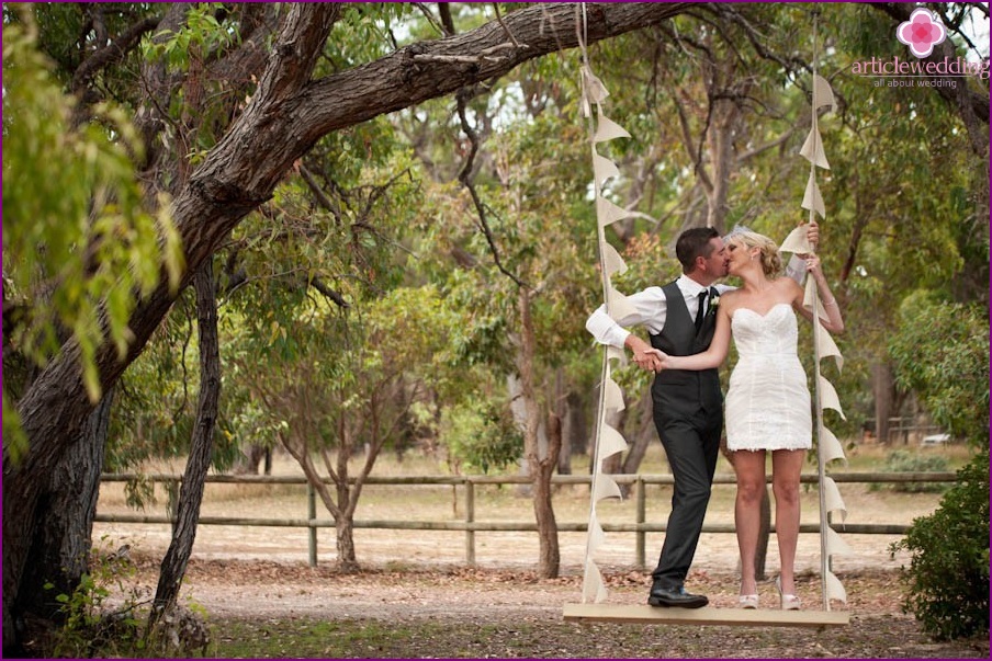 Newlyweds on a swing