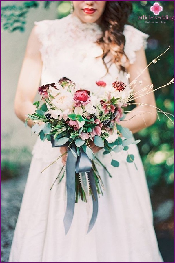 Bouquet with ribbon in dusty blue color.