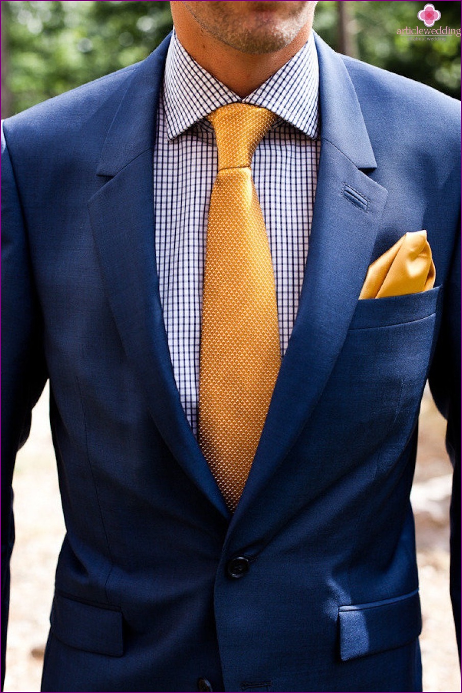 The image of the groom in blue and gold
