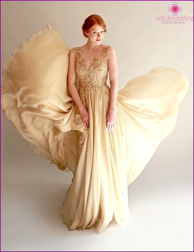 Dress of the bride in gold color