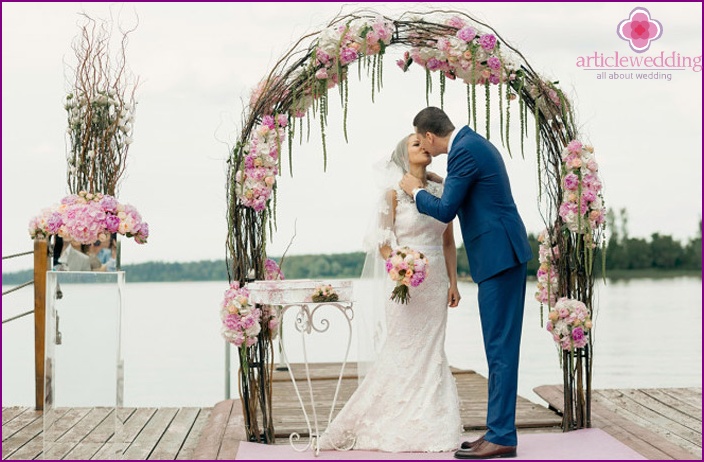 Arch with peonies at an exit ceremony