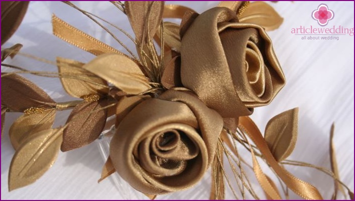The image of the bride and groom: a floral wreath with satin ribbons
