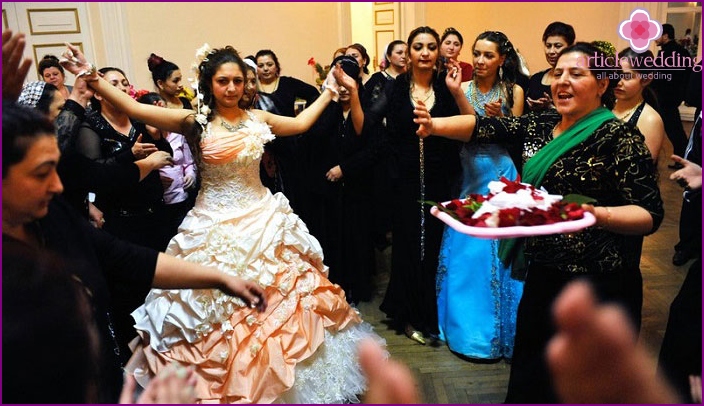 Gypsies carrying a tray with a wedding sheet