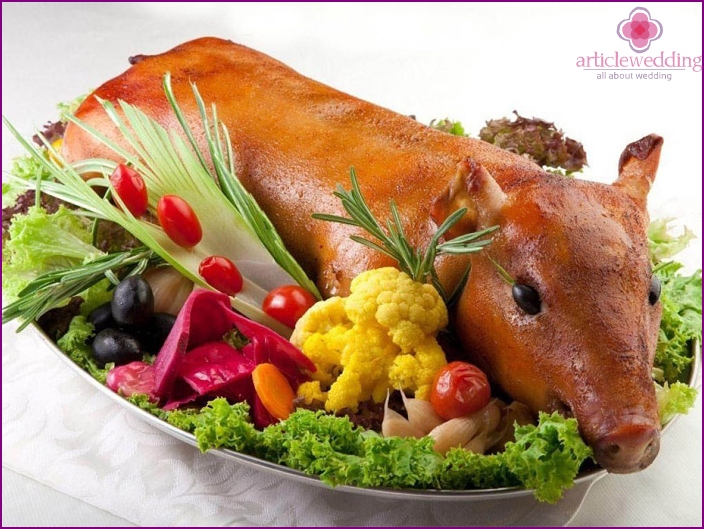 Baked young pig at a wedding table