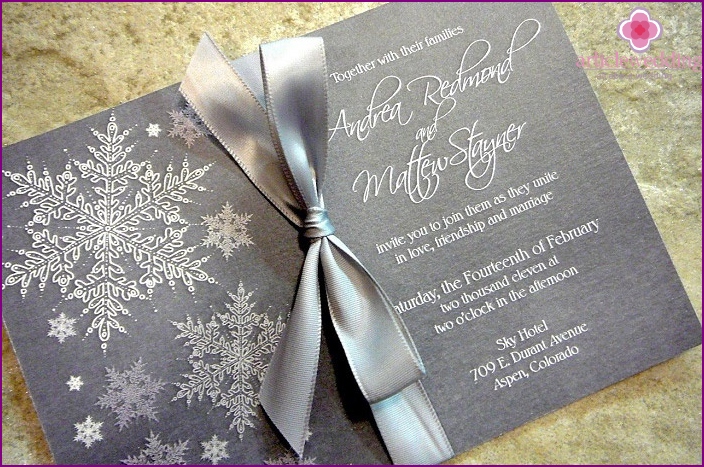 The photo shows an invitation to a winter wedding