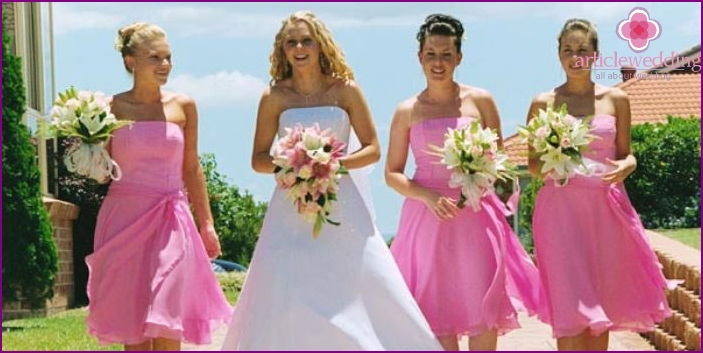 Bride with girlfriends on a raspberry wedding