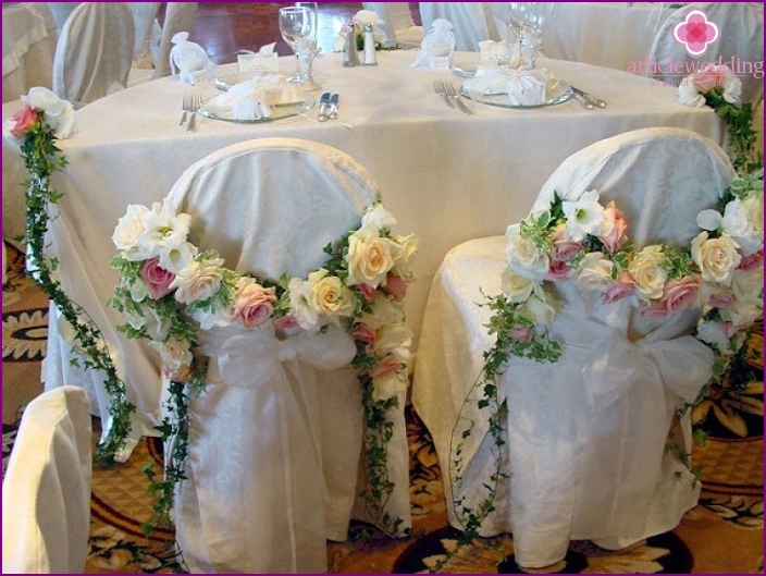 Stylish design of chairs with floral arrangements