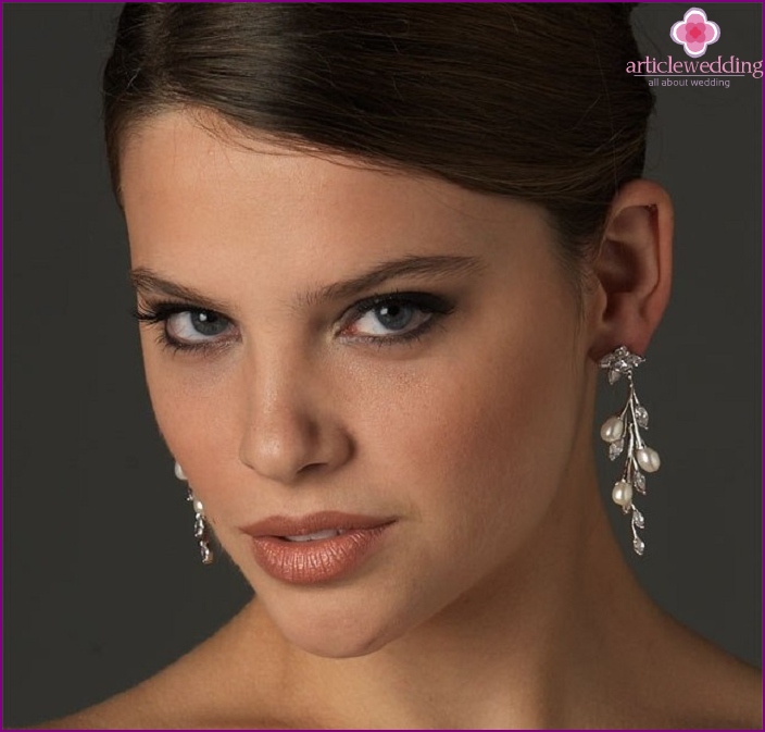 Boucles d'oreilles visage ovale