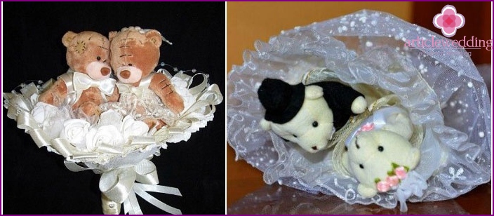 A pair of bears in a bride's bouquet