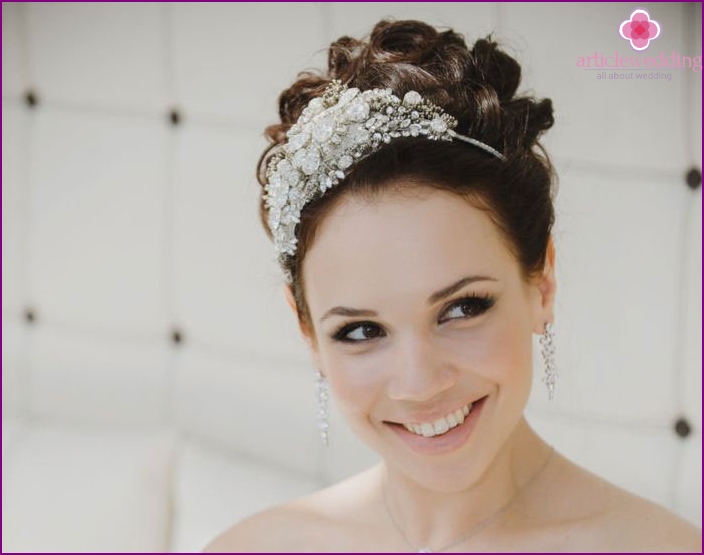 A combination of bridal styling bun and tiaras