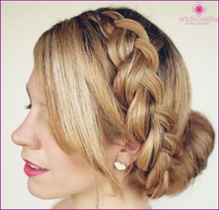 Hairstyle of the bride with a braided braid