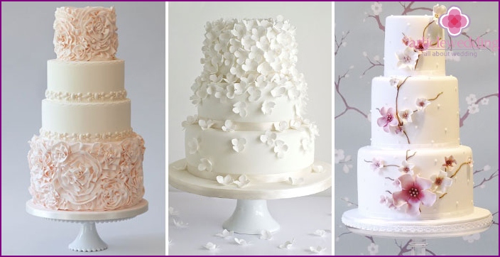 Layered cakes with a cascade of flowers